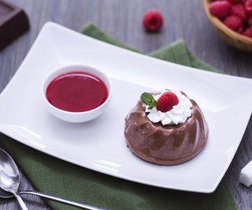 Chocolate pudding with raspberry coulis