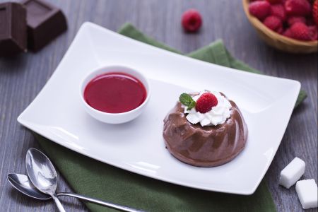 Chocolate pudding with raspberry coulis
