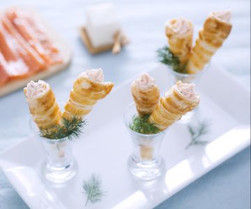Mini puff pastry croissants with salmon and cream cheese filling