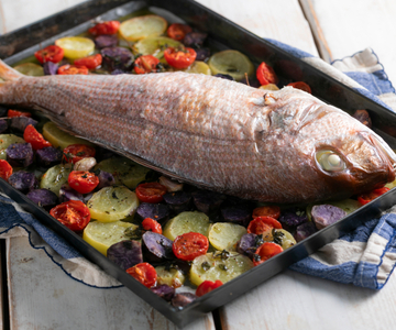 Oven-baked red snapper with potatoes