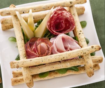 Olive breadsticks with cured meats and cheeses