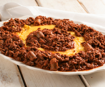 Polenta with braised beef in tomato sauce