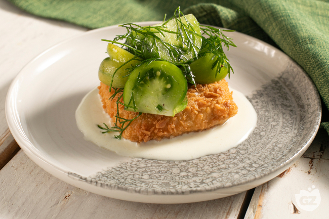 Crispy breaded tofu with yogurt sauce and tomatoes